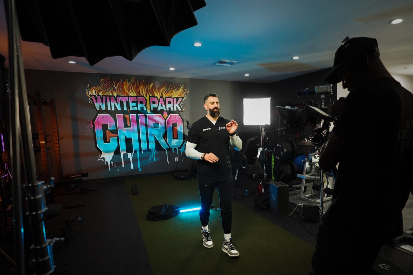 Filming Dr. Chance in front of the Winter Park Chiro mural